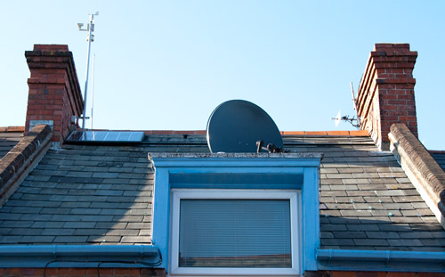 front of the house with the first of four panels fitted on the left