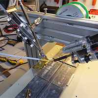 Click to view large image of Prototype solder feed arm