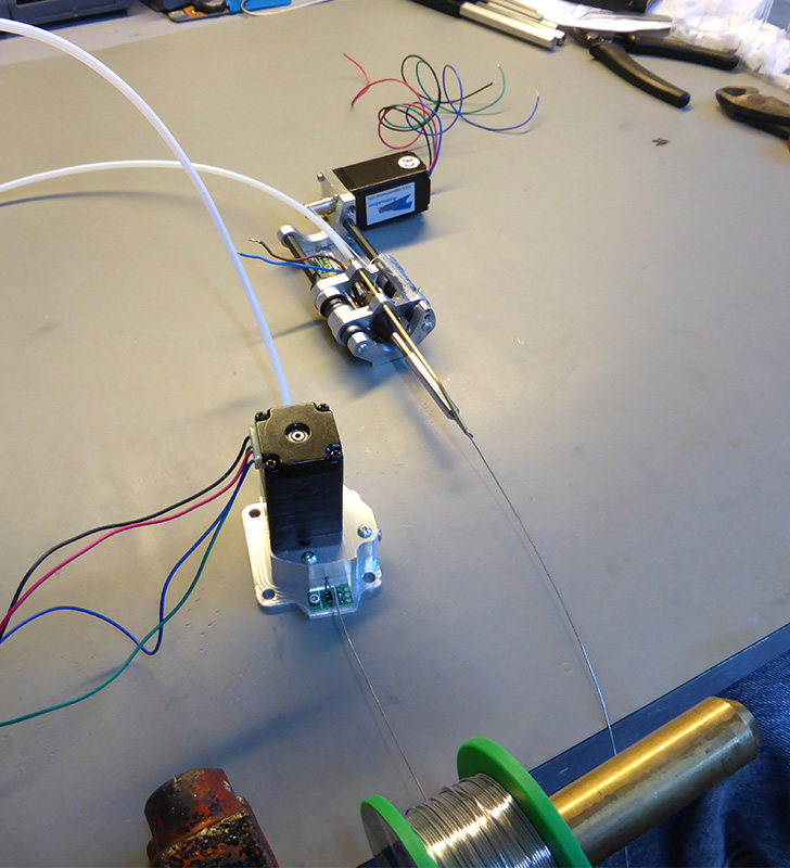 Click to view large image of Checking solder feed into the solder head tube